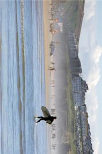 Surfing at Penhale Sands Beach in Cornwall, England Journal