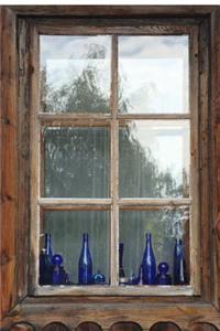 Blue Bottles on a Wooden Windowsill Journal