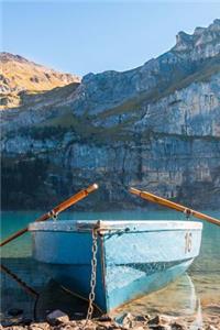 A Weathered Blue Rowboat on a Lake in the Summer Journal