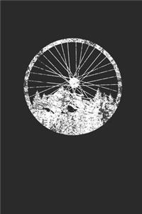 Bicycle Wheel With Mountain And Forest Silhouette