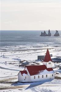 A Rustic White Church with a Red Roof in the Snow by the Sea Journal