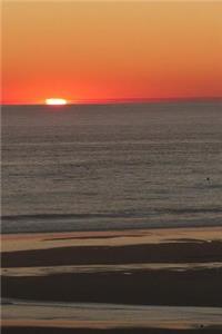 Notebook Sunset Over the Beach and the Ocean