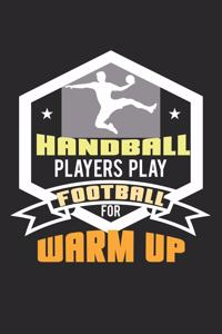 Handball players play football for warm up