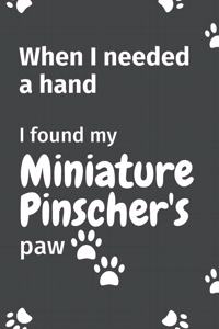 When I needed a hand, I found my Miniature Pinscher's paw