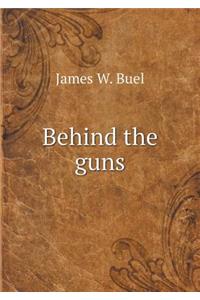 Behind the guns