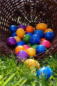 Basket Filled with Colorful Easter Eggs on the Grass Journal