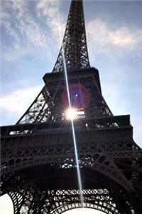 Sunlight Through the Eiffel Tower Paris France Travel Journal
