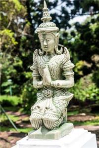 A Kneeling Statue at Bhubing Palace in Thailand