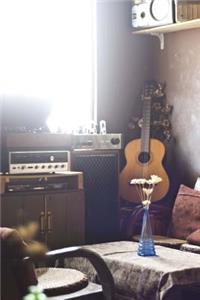 A Vintage Musician's Room with an Acoustic Guitar Journal