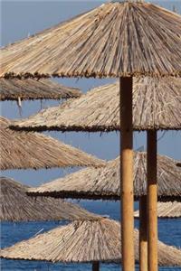 Reed and Bamboo Sun Umbrellas on the Beach Tropical Vacation Journal