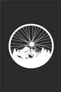 Bicycle Wheel With Mountain And Forest Silhouette