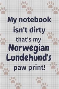 My notebook isn't dirty that's my Norwegian Lundehund's paw print!