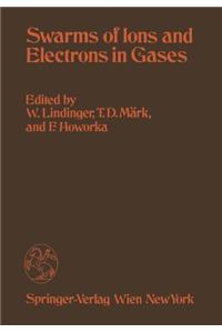 Swarms of Ions and Electrons in Gases