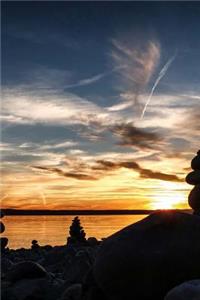 Several Rock Cairns on a Beach in Italy Journal