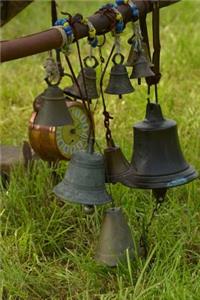 Vignette of Vintage Bells and an Alarm Clock Journal