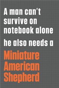 A man can't survive on notebook alone he also needs a Miniature American Shepherd