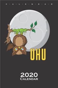 Owl sticked to tree in front of Moon Calendar 2020