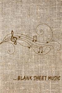 ... Blank Sheet Music Notebook with a background of tissu