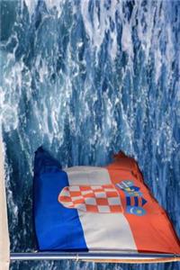 A Flag of Croatia Flying on the Back of a Boat Journal