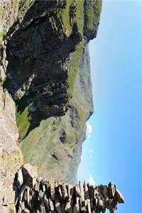 Massive Shale Rock Cairn in the Mountains Journal