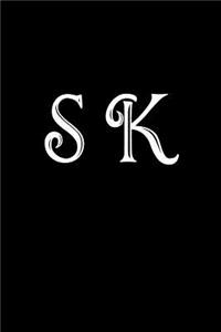 S K