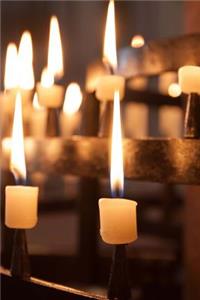 Bright and Shining Candles Glowing in a Church Journal