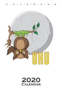 Owl sticked to tree in front of Moon Calendar 2020
