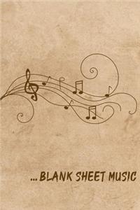 ... Blank Sheet Music Notebook on a background of sand