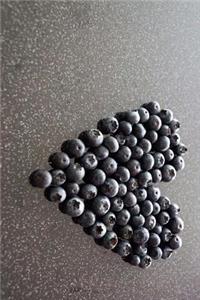 Heart Made of Blueberries on the Table Journal