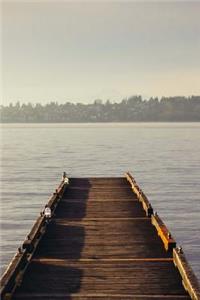 A Weathered Wooden Dock Leading to a Misty Lake Journal