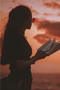 Woman with a Book on the Beach at Sunset Vacation Journal