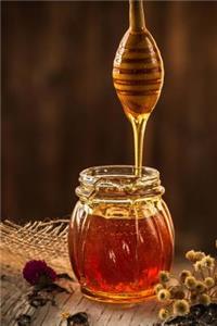 Golden Honey Falling from a Wooden Dipper Journal