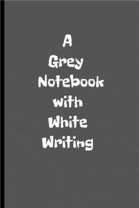 A Grey Notebook with White Writing