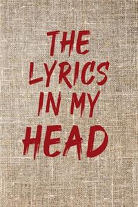 The Lyrics in My Head Notebook with a background of tissu