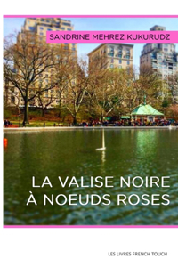 valise noires à noeuds roses