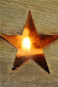 Glowing Cut-Out Star Shape on a Wooden Board Rustic Journal