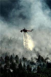 Helicopter Fights Smoldering Forest Fire
