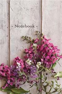 Notebook Flowers on Wooden Patio