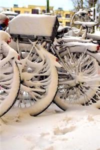 Parked Bikes Covered in snow Journal