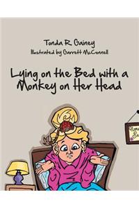 Lying on the Bed with a Monkey on Her Head