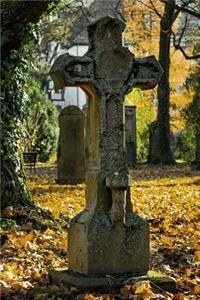 A Weathered Stone Cross Gravestone in Autumn Journal