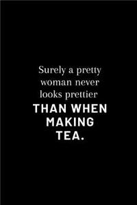surely a pretty woman never looks prettier than when making tea.
