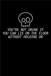 You're not drunk if you can lie on the floor without holding on