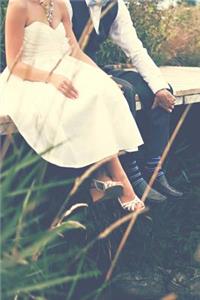 Adorable Bride and Groom Relaxing on a Bridge Journal