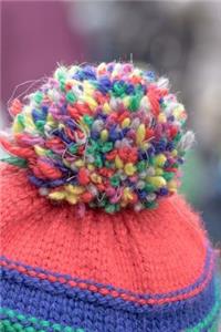 Colorful Pom Pom on a Knitted Winter Hat Journal