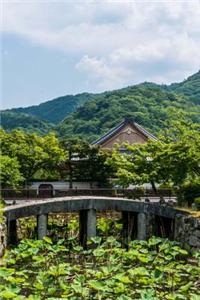 A Beautiful Lily Pond and Bridge in Arashiyama, Japan
