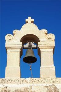 A Church Bell and Cross Against a Blue Sky in Greece Journal