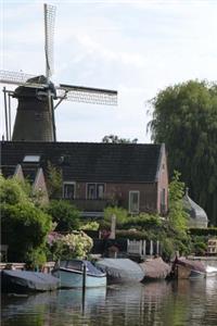 A Beautiful Windmill on the Water in Holland