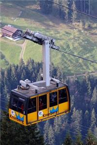 Riding in a Yellow Cable Car Gondola in the Alps During the Summer Travel Journal