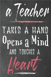 A teacher takes a hand opens a mind and touches a heart